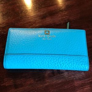Kate Spade turquoise wallet.